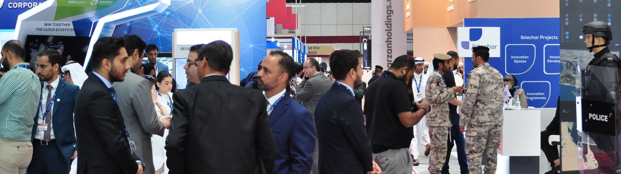 Visitors and exhibitors meeting in Milipol Qatar's aisles and stands