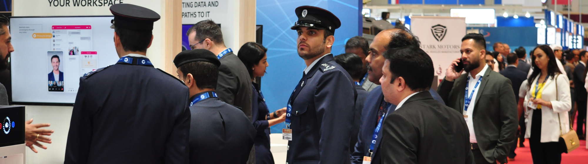 Visitors and exhibitors meeting in Milipol Qatar's aisles and stands