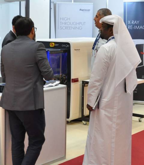 Visitors and exhibitors meeting on a stand at Milipol Qata