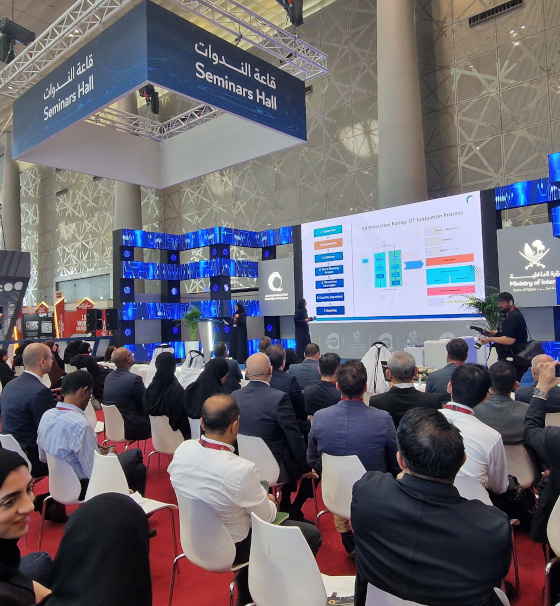 Audience attending a seminar at Milipol Qatar 2024, with participants listening to speakers on stage