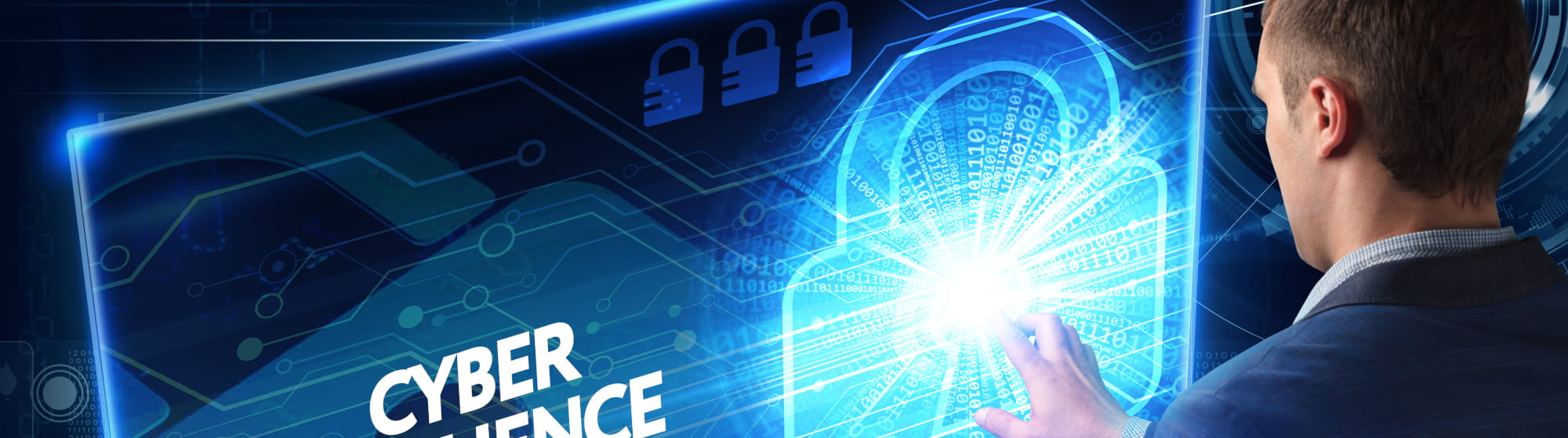 A man in front of a screen with a key lock meaning the cybersecurity