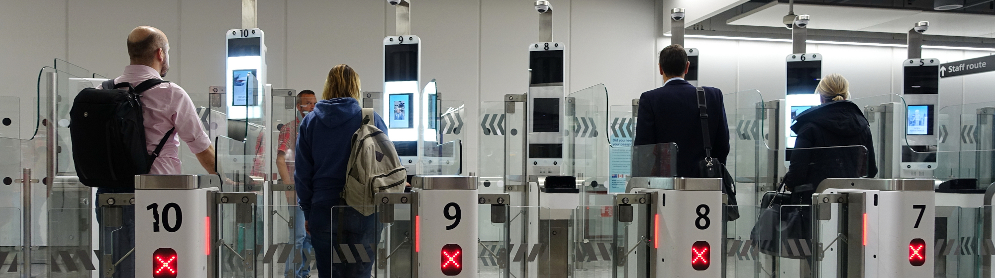 Travellers at security checkpoint in an airport