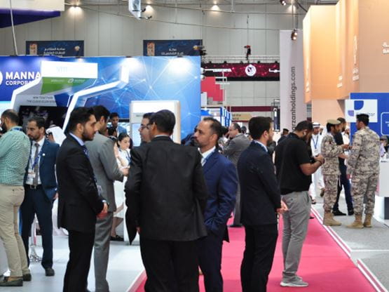 People discussing or meeting in the exhibition aisle