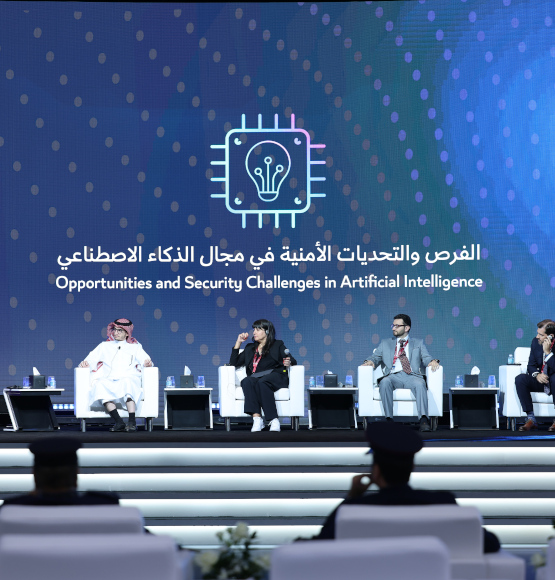 Panel discussion on opportunities and security challenges in artificial intelligence at Milipol Qatar 2024, with speakers seated on stage and audience in foreground