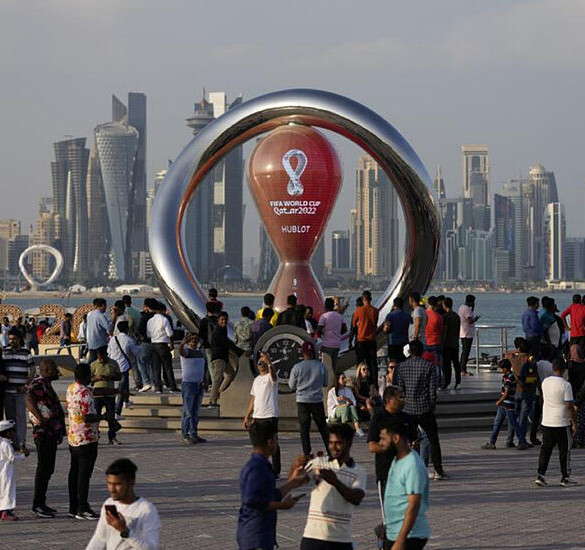 World Cup sculpture in front of the Doha's skyline