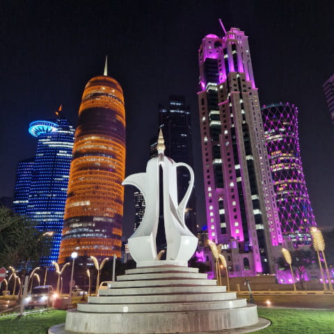 World Cup sculpture in front of the Doha's skyline