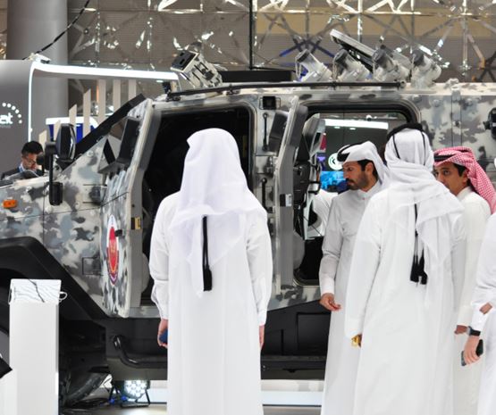 Visitors in front of a truck at Milipol Qatar